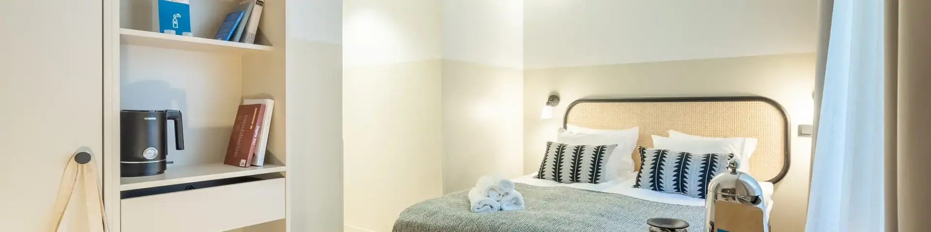 a room with a bed and a desk