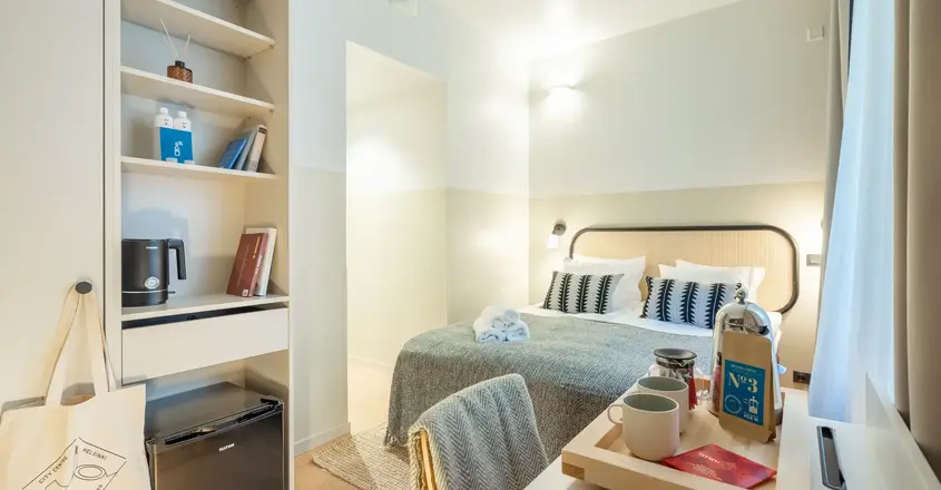 a room with a bed and a desk