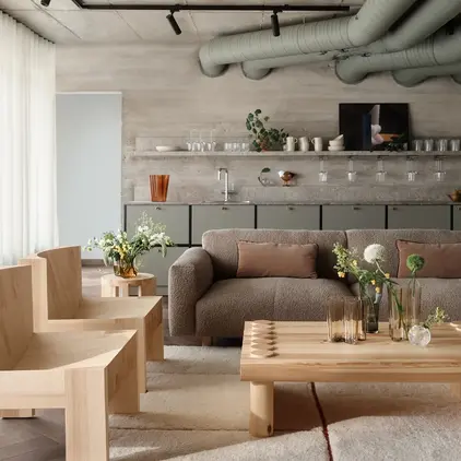 a living room with a couch and chairs