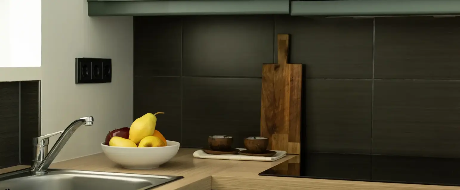 a bowl of fruit on a counter