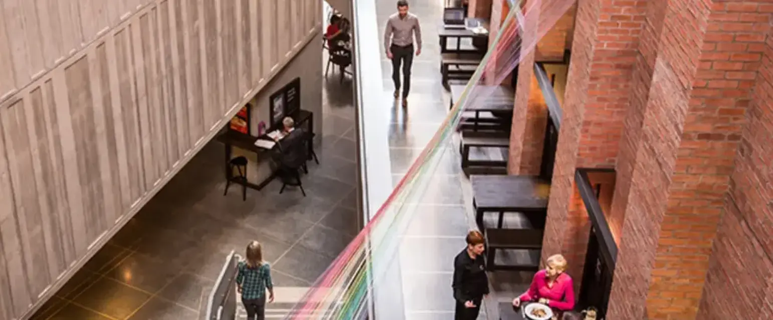 a group of people in a restaurant at the Metropolitan Art Centre in Belfast 