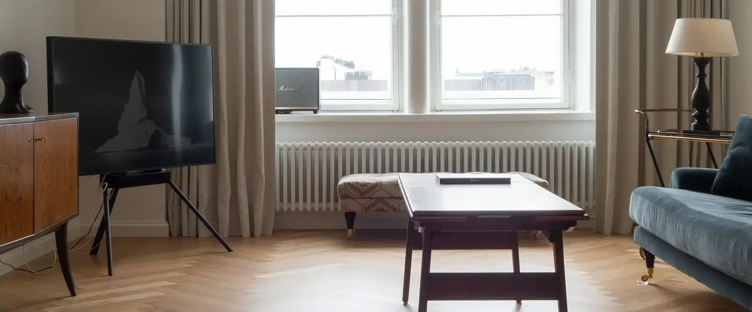 a living room with a tv and a table