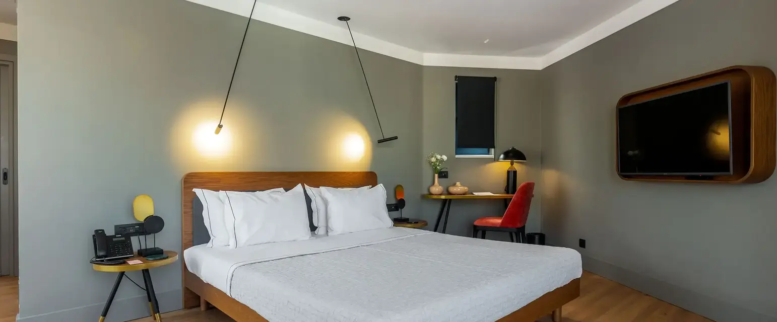 a bed with a wood headboard and a wood floor