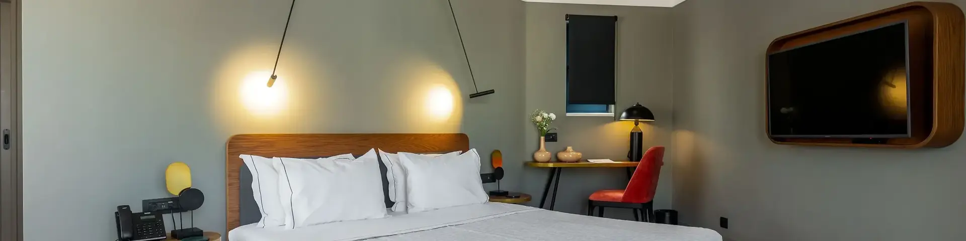 a bed with a wood headboard and a wood floor