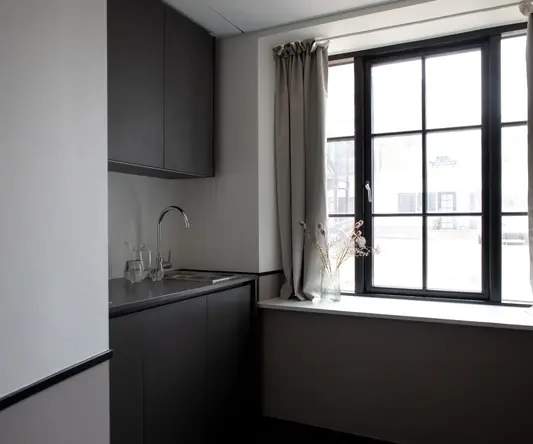 a kitchen with a window and sink