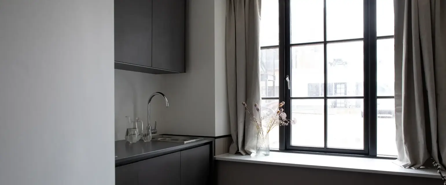 a kitchen with a window and sink