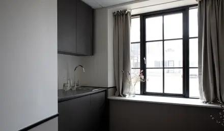 a kitchen with a window and sink