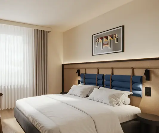 a bedroom with a bed and chair