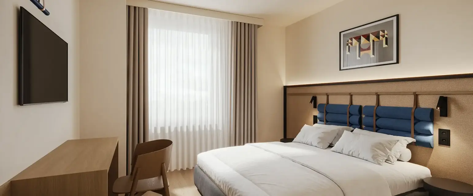 a bedroom with a bed and chair