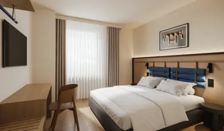 a bedroom with a bed and chair
