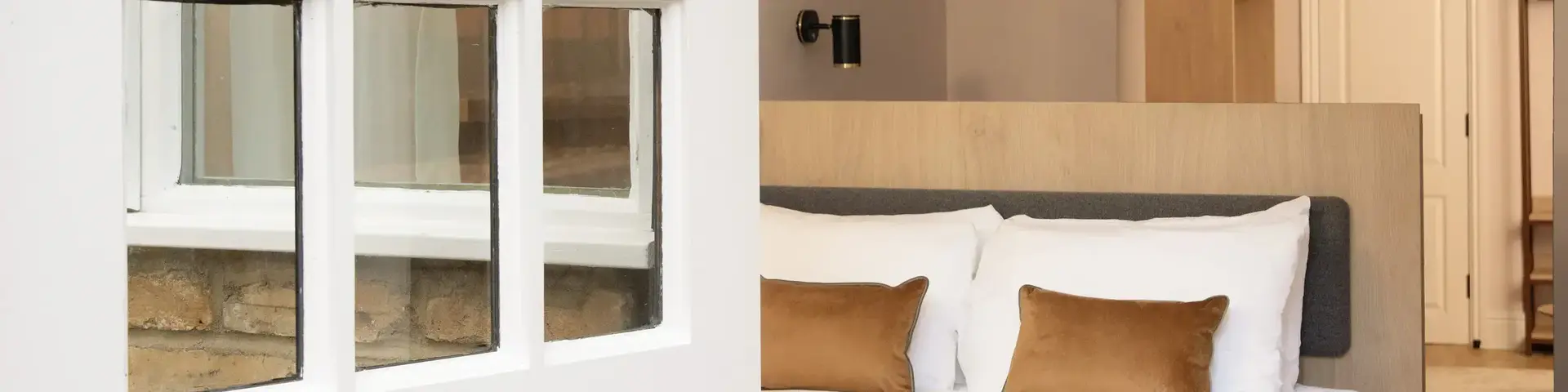 a white door with glass windows and a bed