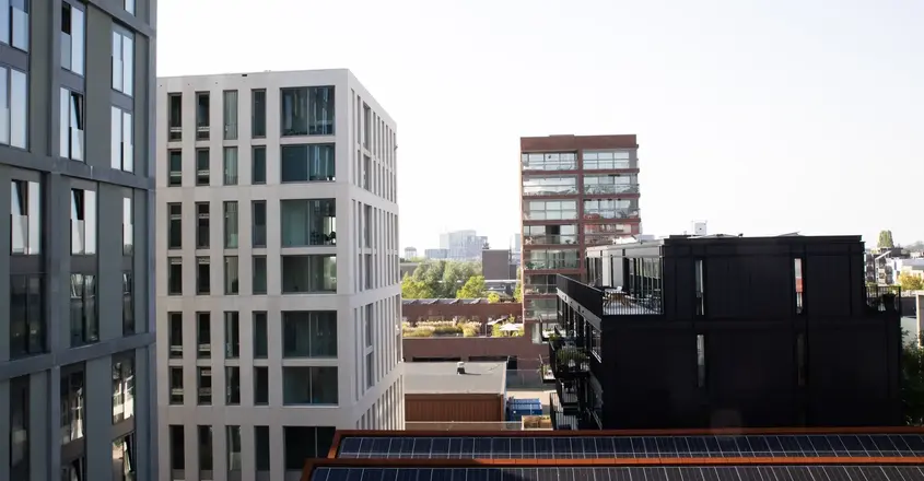 a group of buildings with solar panels