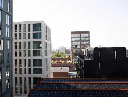 a group of buildings with solar panels