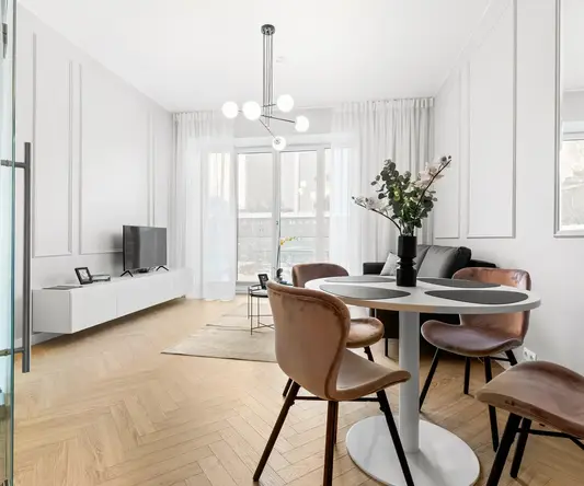 a room with a table and chairs