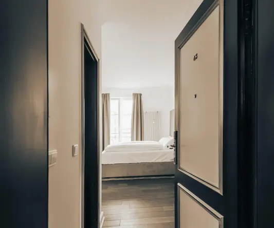 a room with a bed and a door
