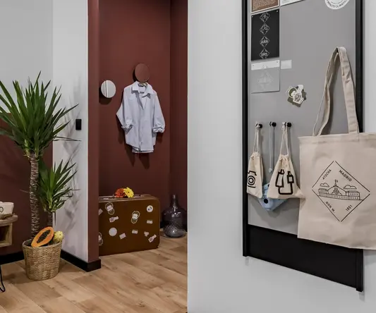a room with a grey board and a brown and white wall