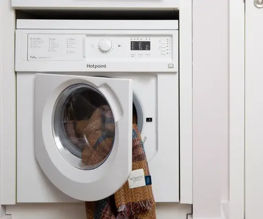 a washing machine with a door open