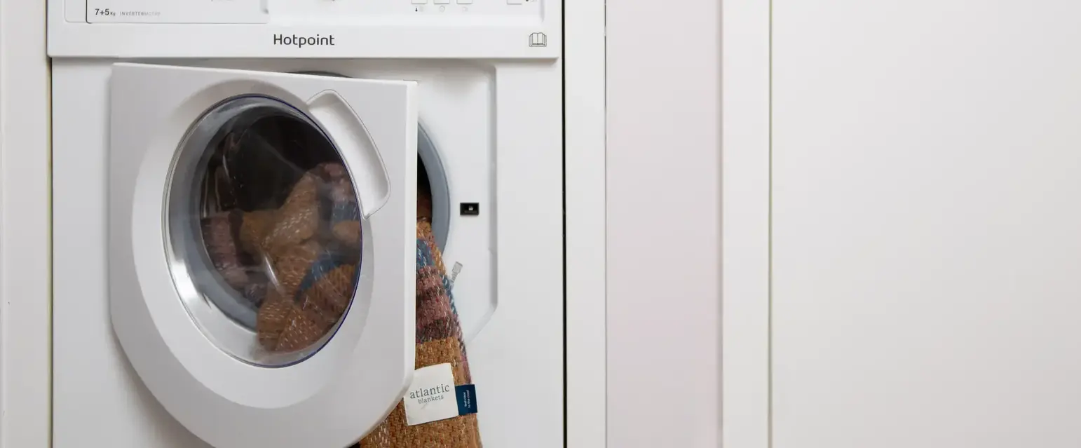a washing machine with a door open