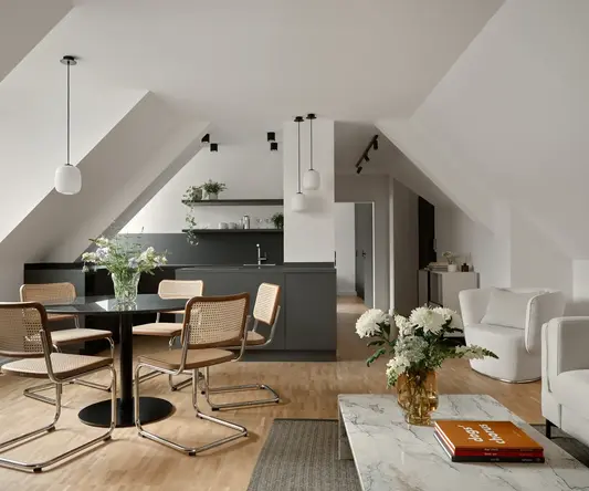 a room with a table and chairs