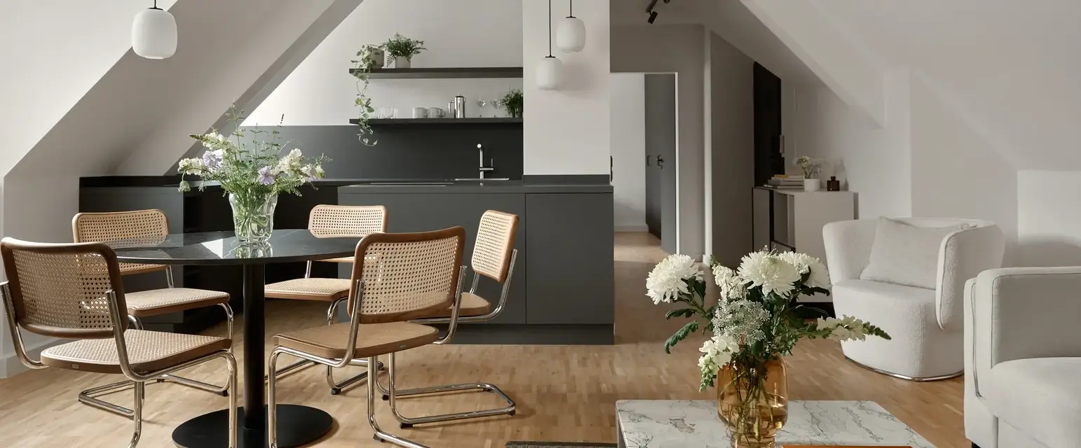 a room with a table and chairs