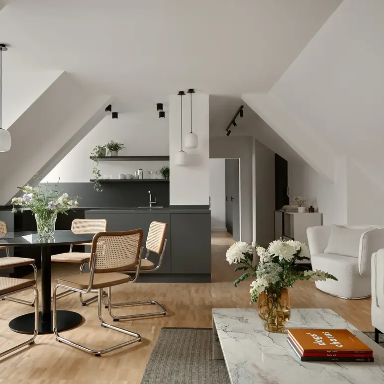 a room with a table and chairs