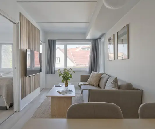 a living room with a couch and a table