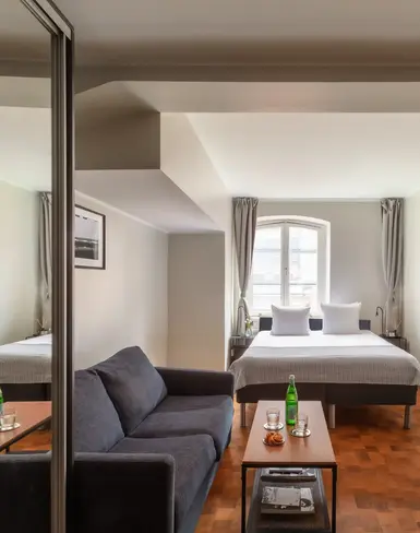 a room with a bed and a television