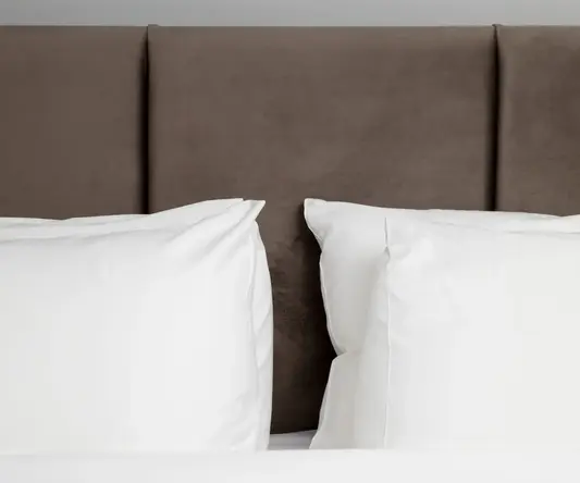 a bed with white pillows