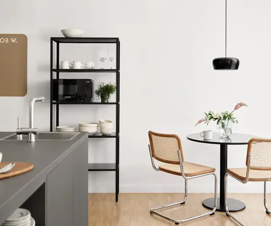 a kitchen with a table and chairs