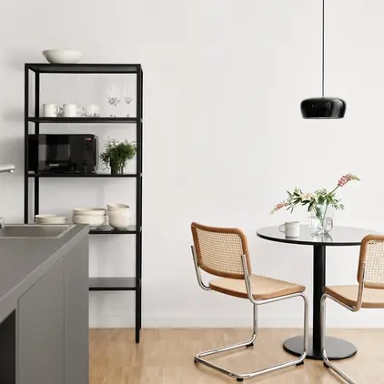 a kitchen with a table and chairs