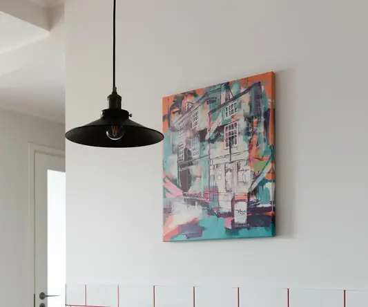 a table with a painting on the wall