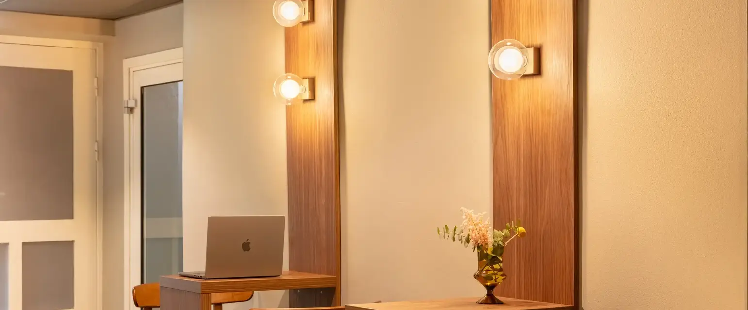 a room with a laptop and chairs