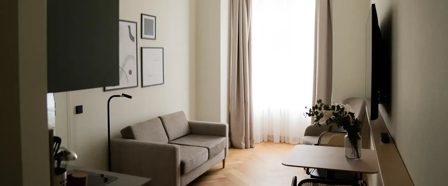a living room with a tv and couch