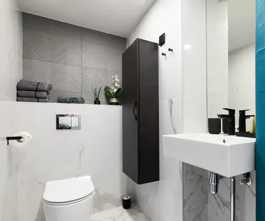 a bathroom with a sink and toilet