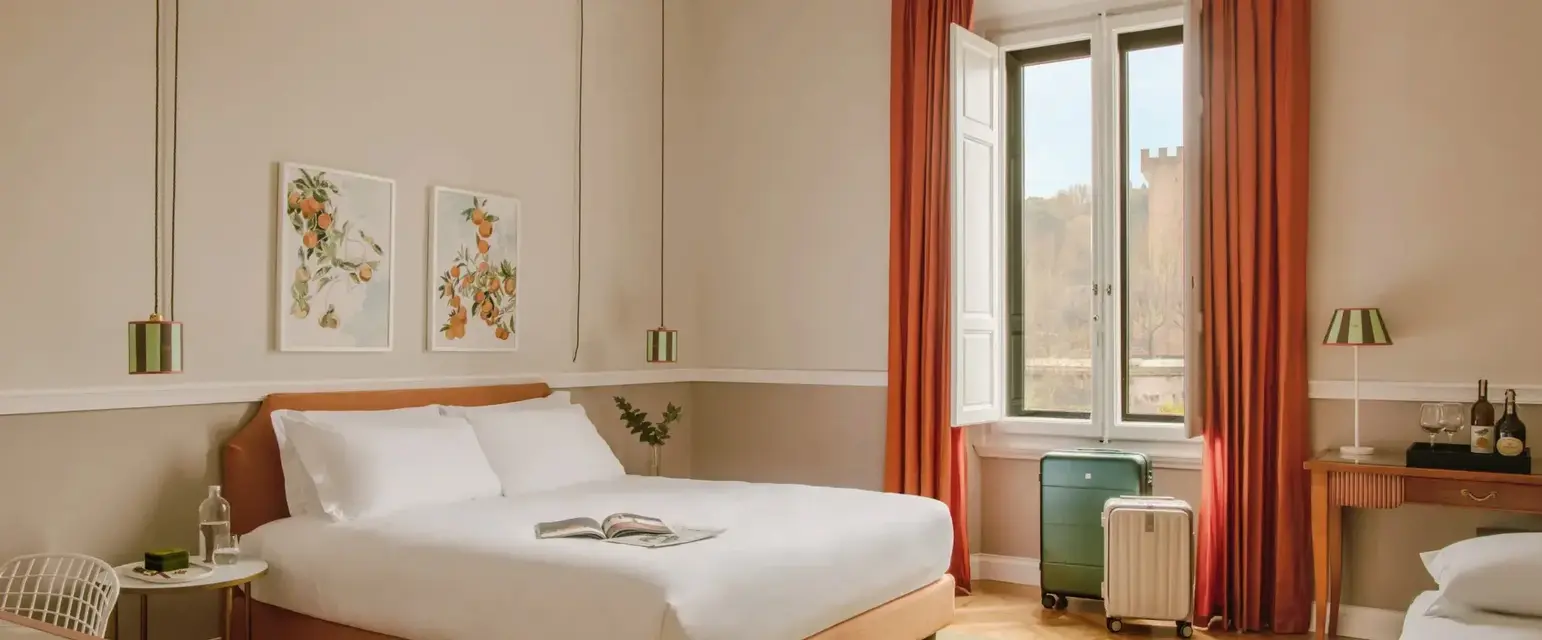 a bedroom with a bed and orange curtains