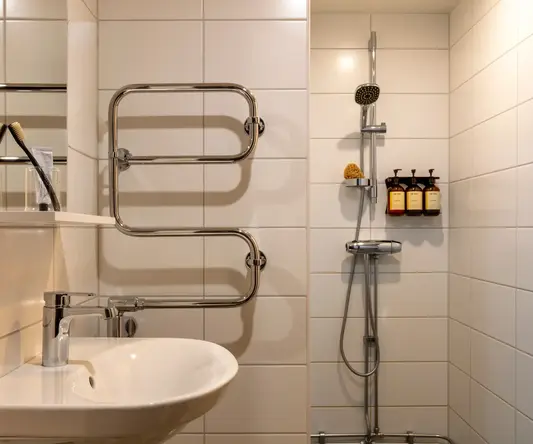 a bathroom with a sink and shower