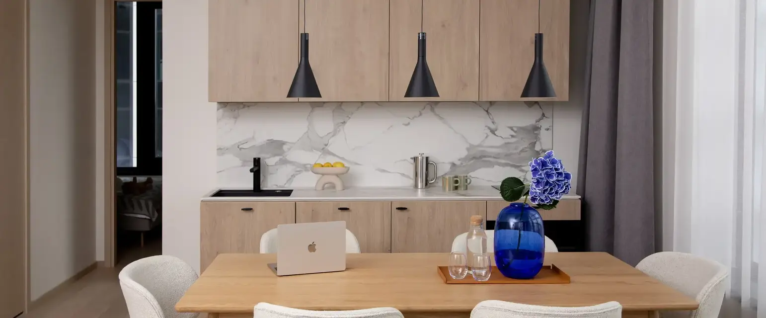 a kitchen with a table and chairs