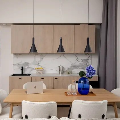 a kitchen with a table and chairs