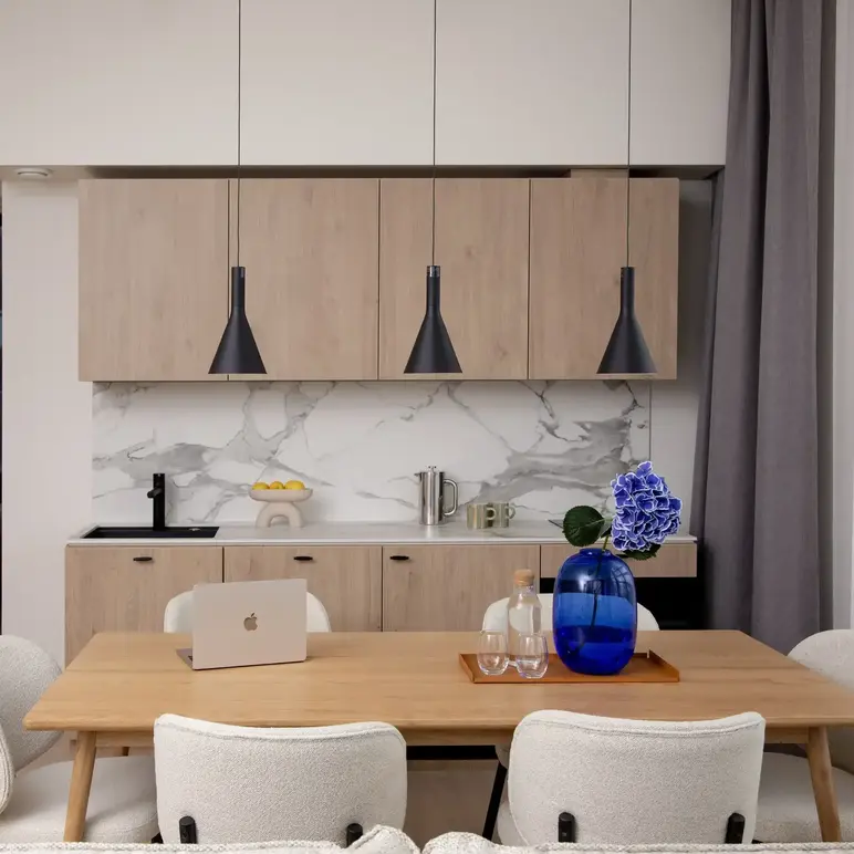 a kitchen with a table and chairs