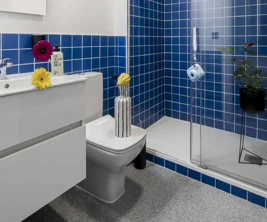 a bathroom with blue tiles