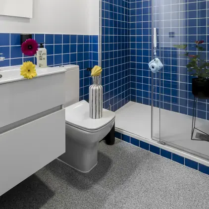 a bathroom with blue tiles