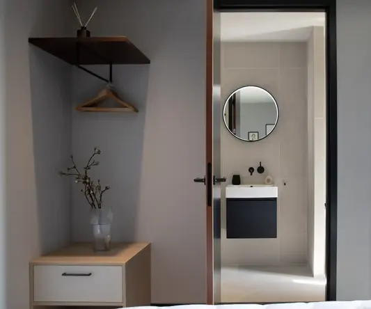 a bathroom with a mirror and a sink