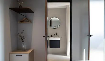 a bathroom with a mirror and a sink