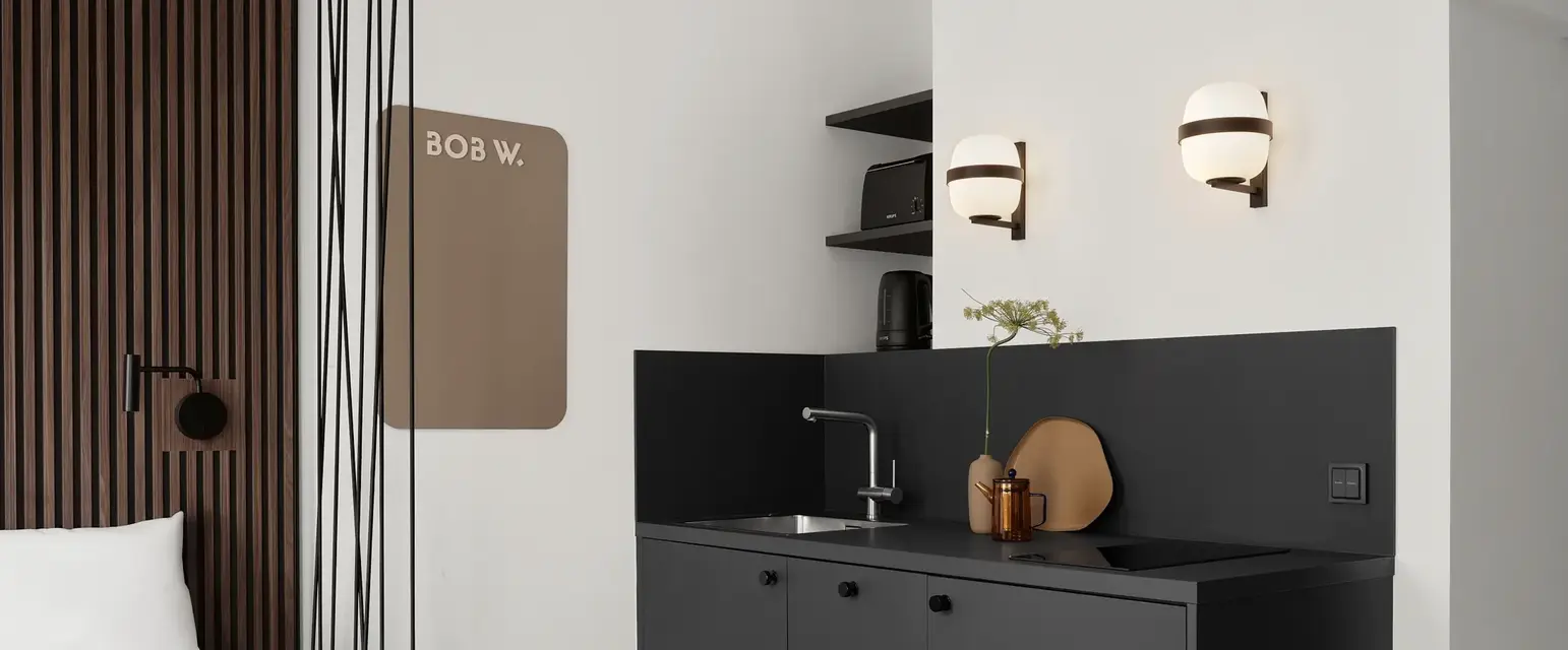 a room with a bed and a sink