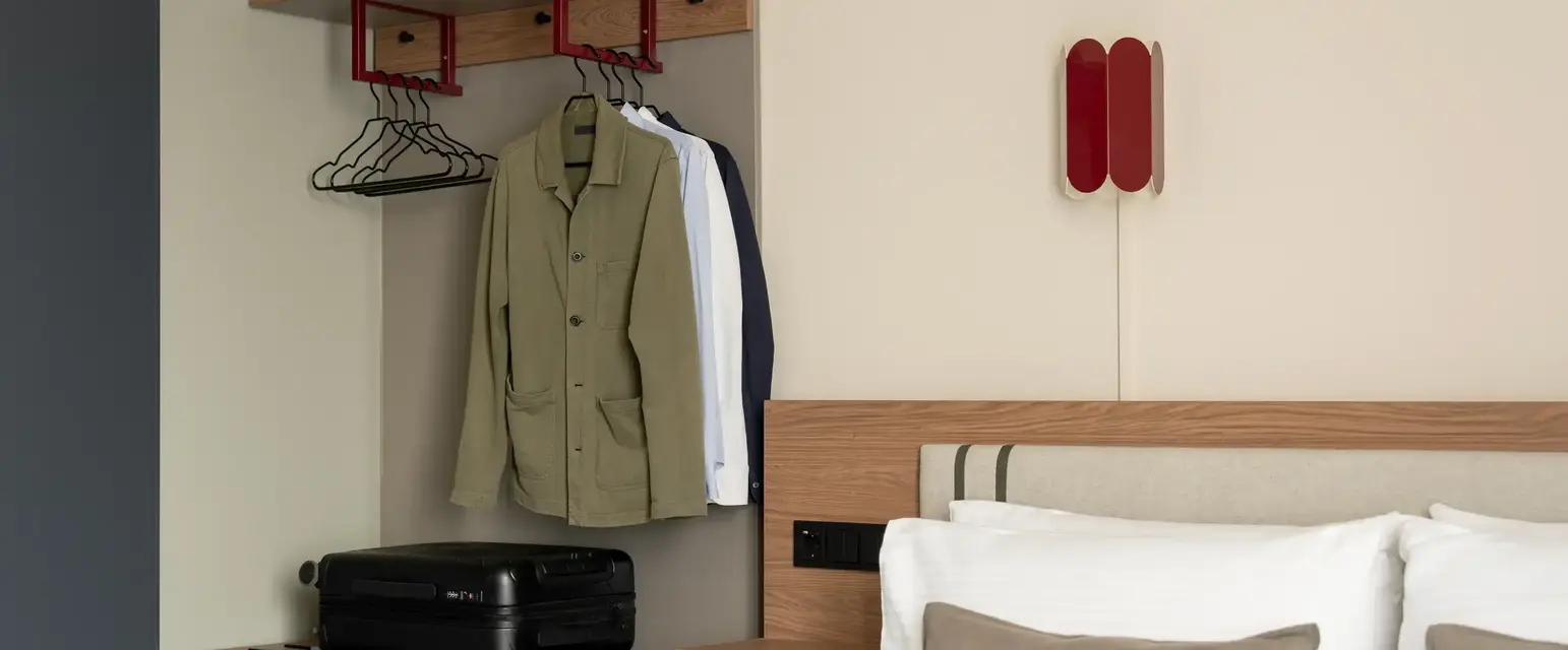 a room with a bed and a bed with a bed and a dresser