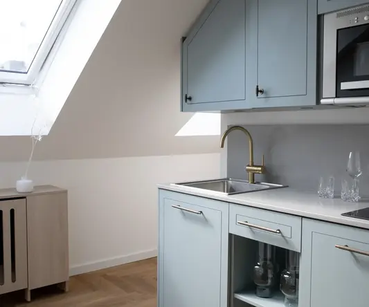 a kitchen with a sink and a microwave