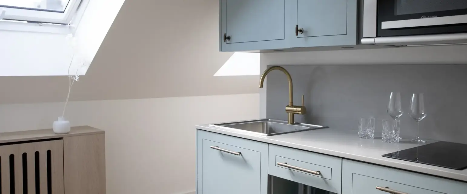 a kitchen with a sink and a microwave