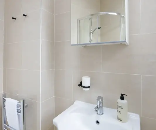 a bathroom with a mirror and sink