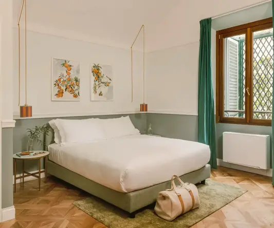 a bedroom with a bed and a bag