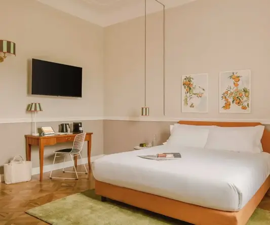 a bed with a tv and a table in a room